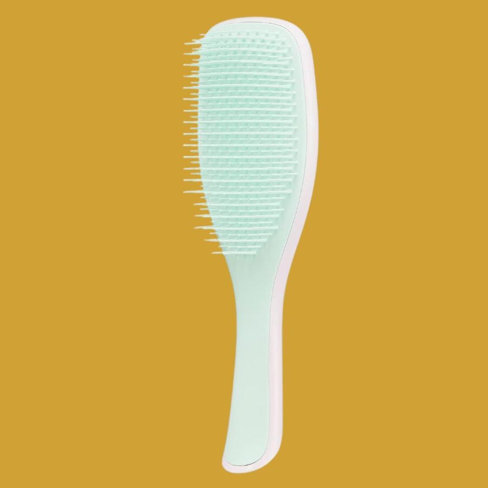 A flexible-teeth detangling brush
