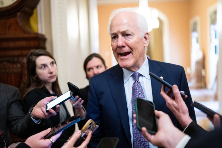 Sen. John Cornyn (R-Texas) speaks with reporters as he leaves the Senate Republicans' lunch on Jan. 24.