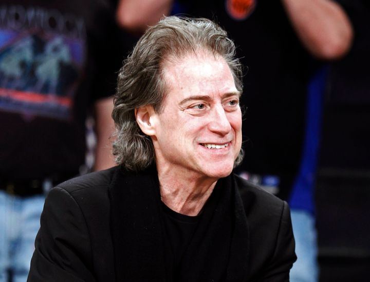Comedian Richard Lewis, shown here at a 2012 NBA game in Los Angeles, was known for stream-of-consciousness diatribes and an all-black wardrobe. He died Tuesday night at his home in Los Angeles.