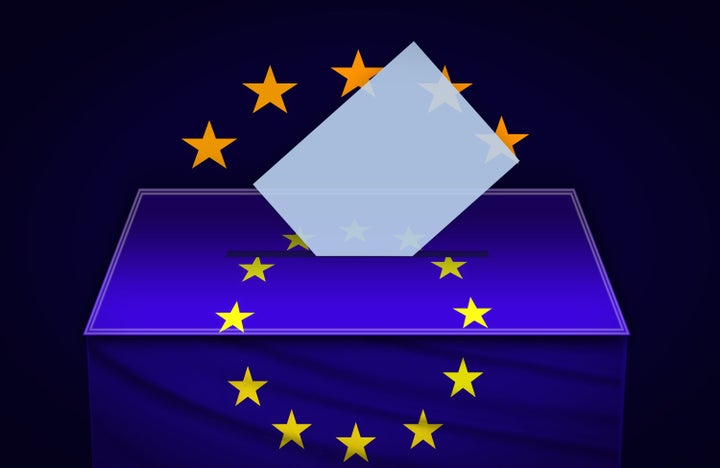 Voting ballot and box in front of the EUROPEAN UNION flag.