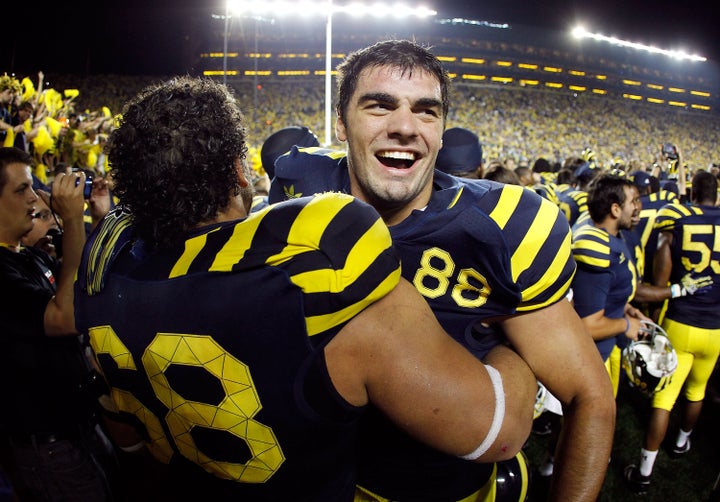 Craig Roh celebrates Michigan's victory over Notre Dame in 2010.