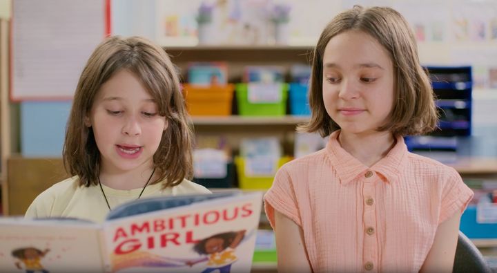 "It’s just telling us to be powerful. Like, I don’t get what the problem with that is,” 9-year-old Nuli (left) says about author Meena Davis' 2021 children's book, "Ambitious Girl." The child appears in "The ABCs of Book Banning" alongside 10-year-old Kika (right).