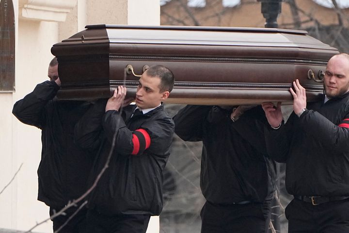 Workers carry the coffin of Russian opposition leader Alexei Navalny to the Church of the Icon of the Mother of God Soothe My Sorrows, in Moscow, Russia, on March 1, 2024. 