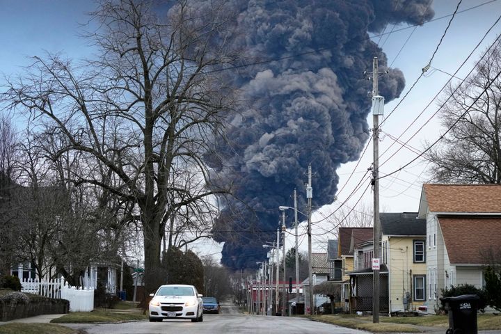 A black plume rises over East Palestine, Ohio, after responders set fire to rail tanker cars full of vinyl chloride on Feb. 6, 2023. 