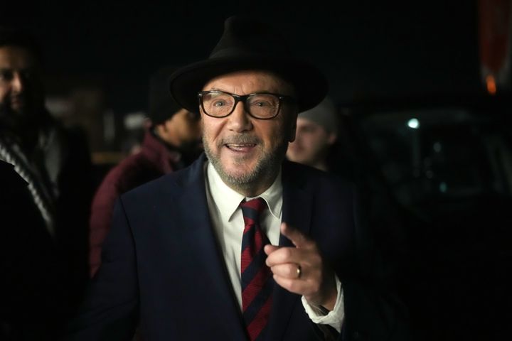 Workers Party of Britain candidate George Galloway celebrates with supporters at his campaign headquarters after being declared the winner in the Rochdale by-election.