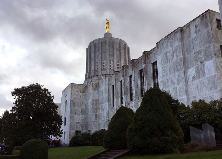 FILE - Clouds hover over the Oregon Capitol, Jan. 11, 2018, in Salem, Ore. (AP Photo/Andrew Selsky, File)