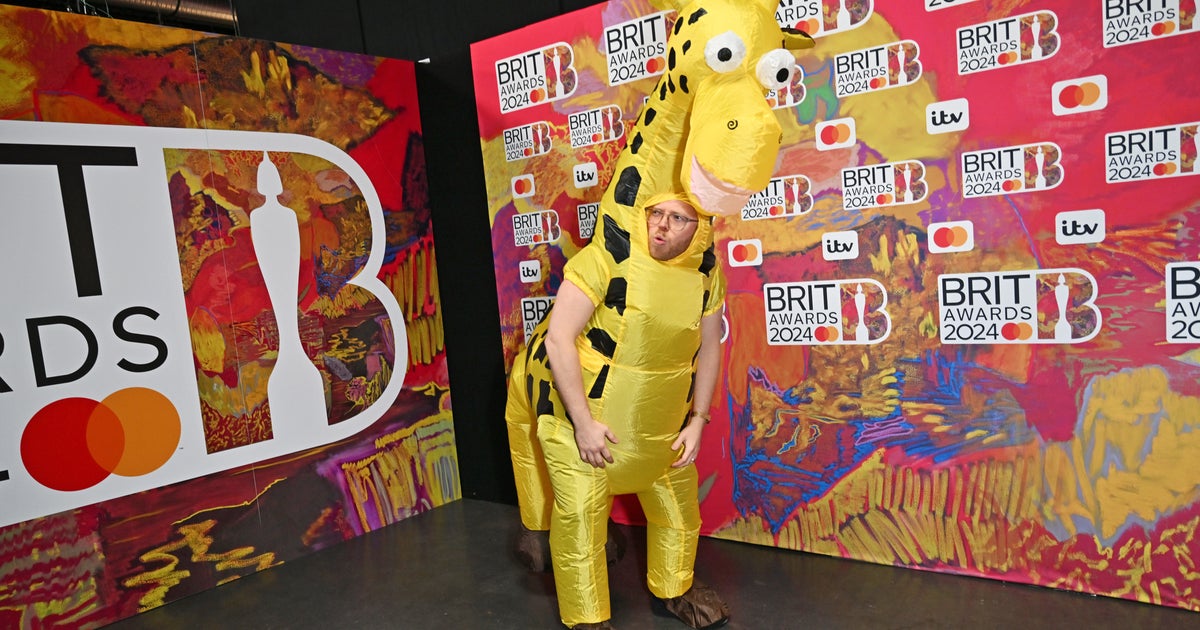 Comedian Rob Beckett Leaves BRIT Awards Viewers Baffled As He Turns Up As A... Giraffe