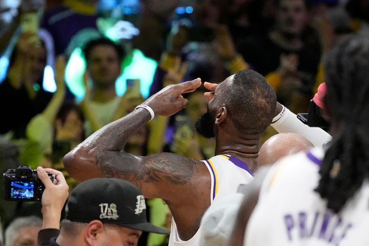 Los Angeles Lakers forward LeBron James acknowledges fans after scoring to become the first NBA player to reach 40,000 points in a career during the first half of an NBA basketball game against the Denver Nuggets Saturday, March 2, 2024, in Los Angeles. (AP Photo/Mark J. Terrill)