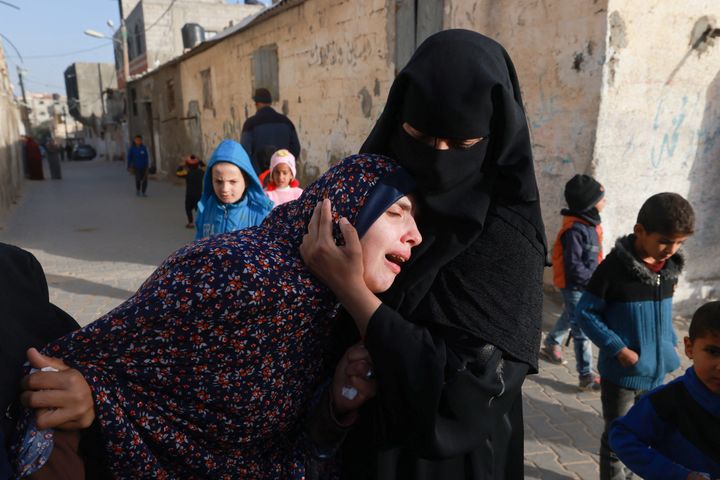 Rania Abu Anza (L), the mother of twin babies Naeem and Wissam who were killed in an overnight Israeli airstrike, mourns their death ahead of their burial in Rafah in the southern Gaza Strip on March 3, 2024.