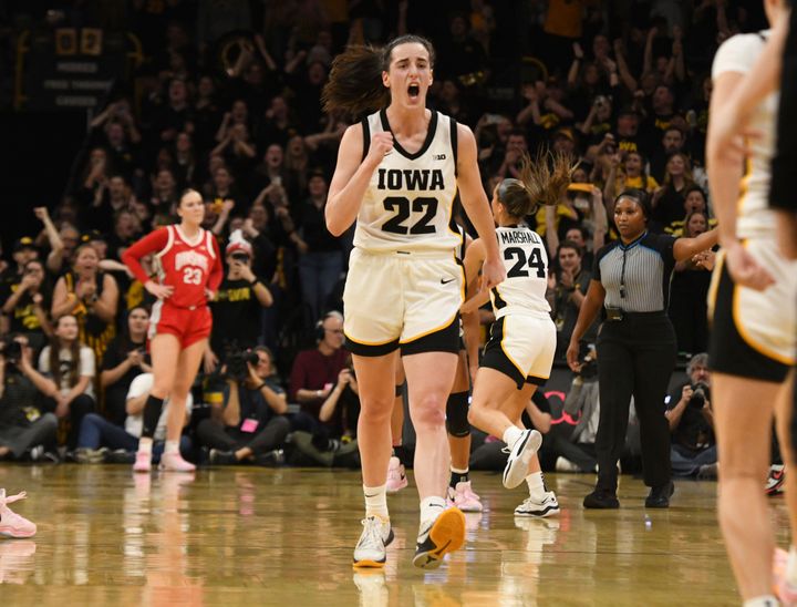 Iowa guard Caitlin Clark (22) celebrates after becoming the all-time leading scorer in NCAA Division I basketball during the first half of a college game against Ohio State, Sunday, March 3, 2024, in Iowa City, Iowa. (AP Photo/Cliff Jette)