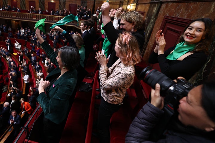 Mps and senators applaud after the results were announced.