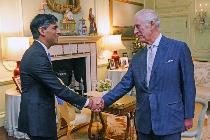 Britain's King Charles III shakes hands as he welcomes Britain's Prime Minister Rishi Sunak at Buckingham Palace, in central London, on Feb. 21 for their first in-person audience since the king's diagnosis with cancer.