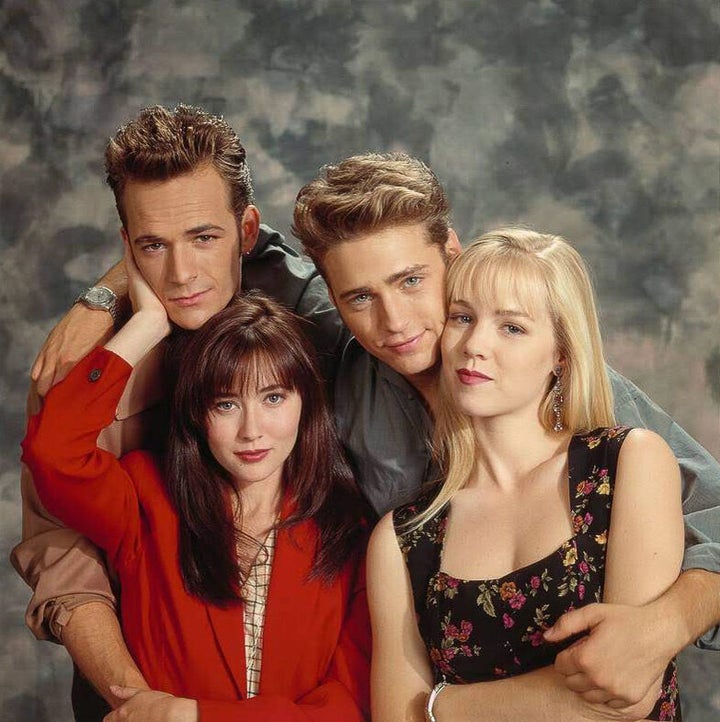 Actors Luke Perry, Shannen Doherty, Jason Priestley and Jennie Garth pose for a portrait on the set of "Beverly Hills, 90210" in Sep. 1991 in Los Angeles. 