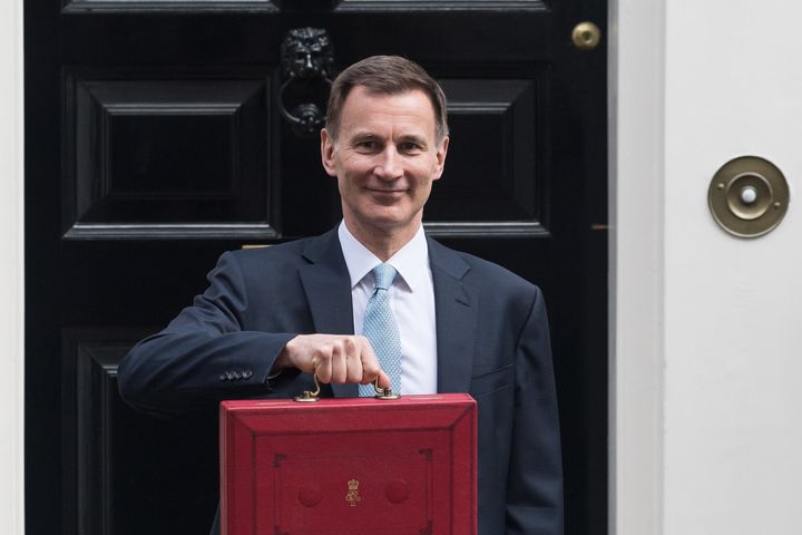 Jeremy Hunt with the red box containing his Budget speech on the steps of 11 Downing Streetl