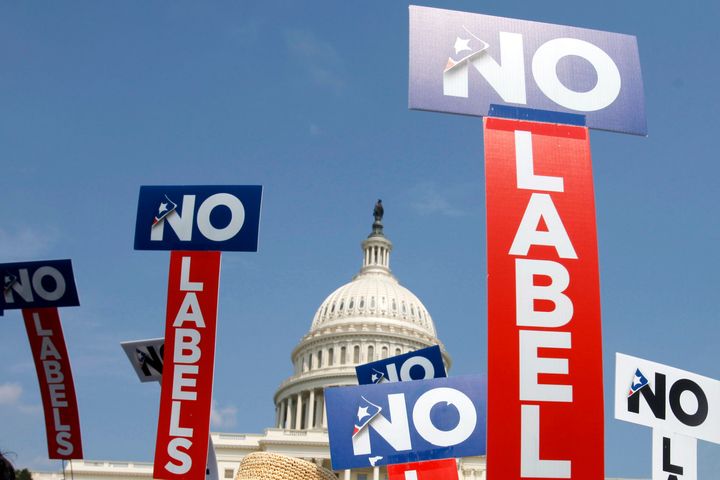 FILE - People with the group No Labels hold signs during a rally on Capitol Hill in Washington, July 13, 2013. The third-party presidential movement No Labels plans to meet on March 8, 2024, amid fierce pressure on donors and potential candidates from Donald Trump critics who fear the deep-pocketed group would help the former president return to the White House. No Labels Chief Strategist Ryan Clancy says no candidates will be selected at the meeting. (AP Photo/Jacquelyn Martin, File)