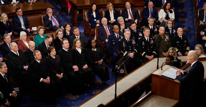 Current and former justices of the U.S. Supreme Court and the Joint Chiefs of Staff listen to President Joe Biden as he delivers the State of the Union address.