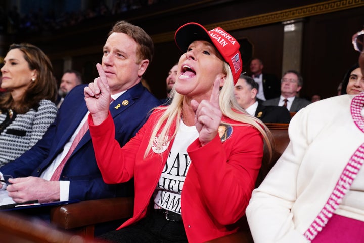 Rep. Marjorie Taylor Greene (R-Ga.) shouts about Laken Riley during Biden's State of the Union on Thursday. He responded to her in off-the-cuff remarks.