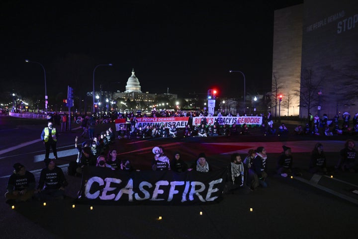 Hundreds of demonstrators demanding an immediate cease-fire in the Gaza Strip unfurled a large Palestinian flag and staged a sit-in on a major roadway President Joe Biden would normally use to reach the U.S. Capitol, just minutes before he is set to address a joint session of Congress on March 7, 2024.