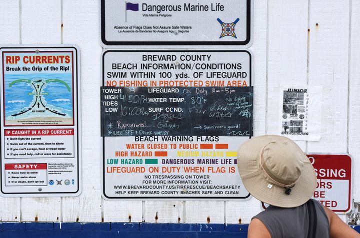Signs showing beach conditions are seen on a lifeguard tower on July 29, 2023 in Cocoa Beach, Florida. 