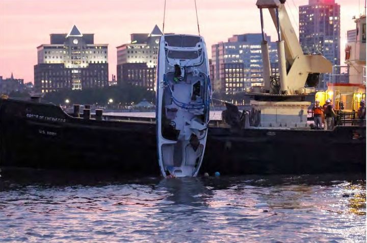 The Stimulus Money is pulled out of the water after its July 12, 2022, capsizing.