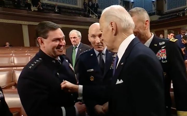 President Joe Biden lightly taps his fist on a top military leader at the State of the Union address. "I keep telling him, he’s got to work on his pecs!”