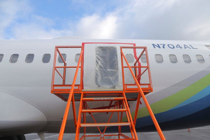 FILE - This photo released by the National Transportation Safety Board shows a gaping hole where the paneled-over door had been at the fuselage plug area of Alaska Airlines Flight 1282. (National Transportation Safety Board via AP, File)