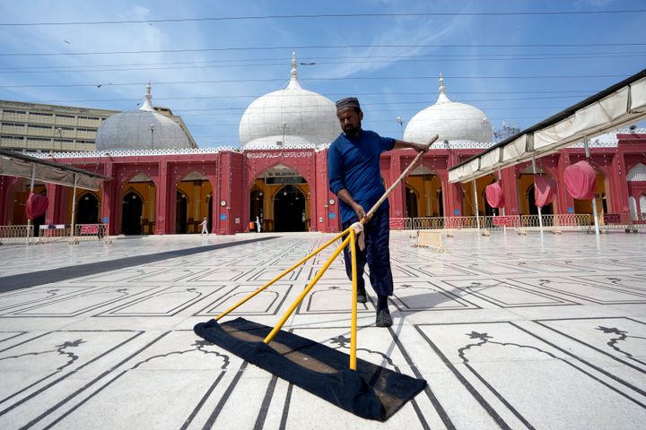 A Pakistani man cleans a mosque in preparation for the upcoming Muslim fasting month of Ramadan, in Karachi, Pakistan, Saturday, March 9, 2024.