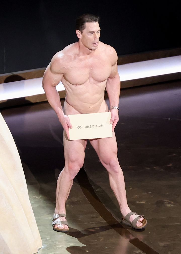 An apprehensive-looking Cena took the stage in just a pair of Birkenstock sandals. 
