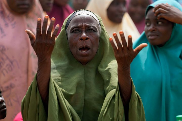 A women prays for the kidnapped LEA Primary and Secondary School students in Kuriga, Kaduna state Nigeria, Saturday, March 9, 2024. Security forces swept through large forests in Nigeria's northwest region on Friday in search of nearly 300 children who were abducted from their school a day earlier in the West African nation's latest mass kidnap which analysts and activists blamed on the failure of intelligence and slow security response. 
