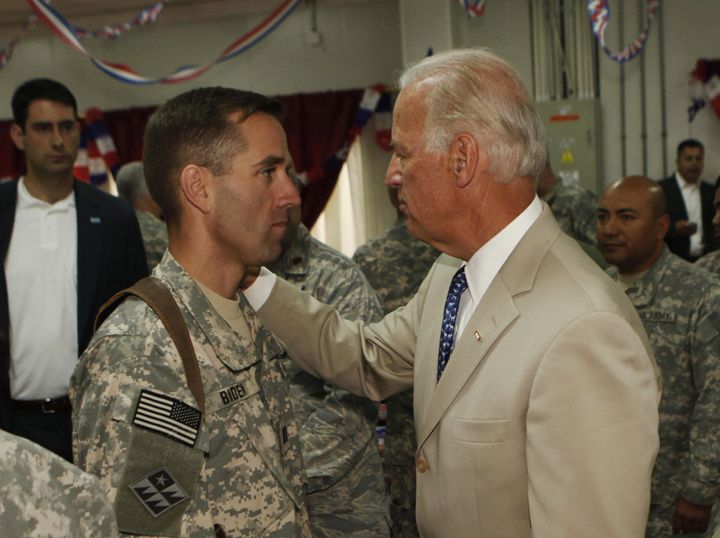 Biden, right, then serving as vice president, talks with his son, U.S. Army Capt. Beau Biden in Iraq on July 4, 2009. Beau Biden died in 2015 from brain cancer.