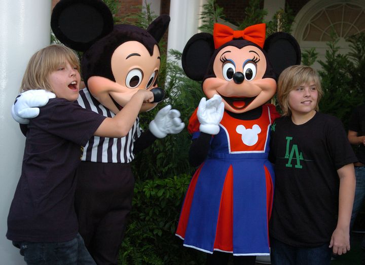 "Suite Life of Zack & Cody" stars Dylan Sprouse, right, and Cole Sprouse, left, pose with Disney characters Mickey and Minnie Mouse before the Disney Channel Games 2007.