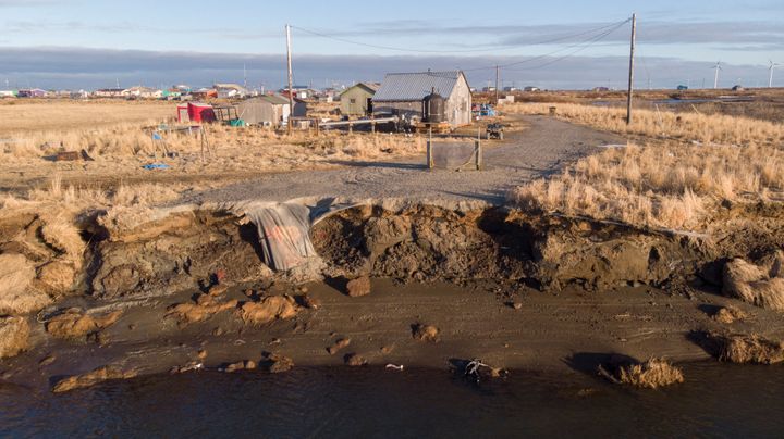 Severe erosion of the permafrost tundra threatens houses at the Yupik Eskimo village of Quinhagak, in the Yukon Delta of Alaska. The Alaska Native village has received $4 million to boost community resilience to permafrost degradation. 