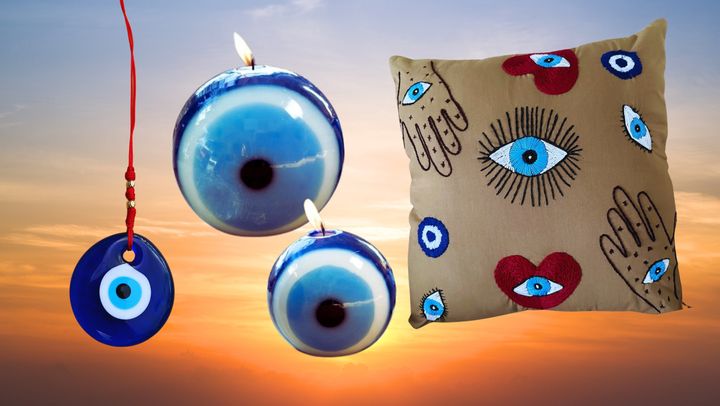 An evil eye wall hanging, evil eye candles and an evil eye pillowcase from Etsy.