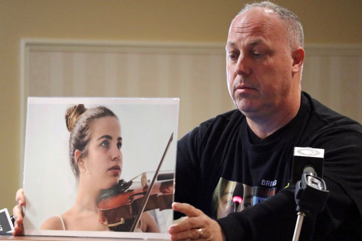 Shlomi Berger, of Holon, Israel, holds a photograph of his daughter Agam, who was taken hostage by Hamas, as he speaks to Maryland lawmakers in Annapolis, Maryland on Thursday, Jan. 18, 2024. Berger was one of several family members of Israeli hostages who came to Maryland's capital to raise awareness about the hostages and share their stories with members of the Maryland General Assembly.