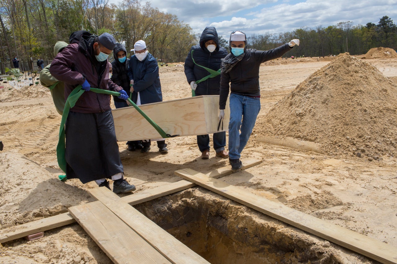 Pakistani immigrant families from Brooklyn bury relatives who have died of COVID-19 on May 9, 2020 at a Muslim cemetery in Morganville, New Jersey.