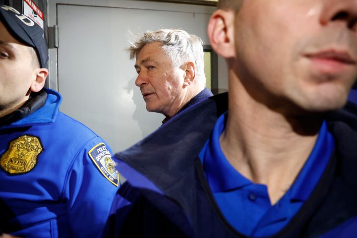 Alec Baldwin is escorted away from a pro-Palestine protest by NYPD officers after clashing with protesters in Midtown Manhattan on Dec.18, 2023, in New York City. 