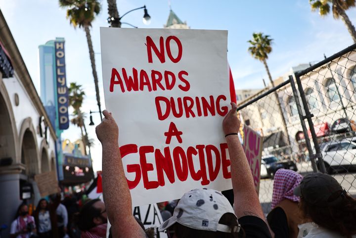 A sign held by a pro-Palestinian demonstrator during the protest outside the 96th Academy Awards on March 10, 2024.