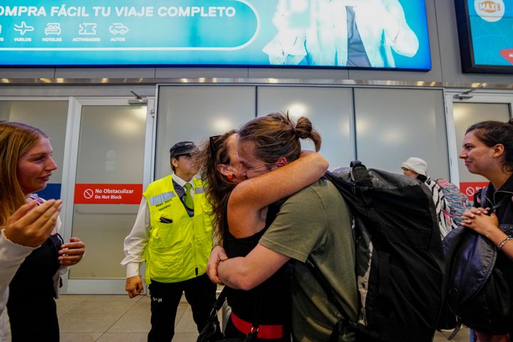 Passenger Diego Valenzuela is embraced by his mother after he arrived in Santiago, Chile, after experiencing Monday's nose dive on a 787 Dreamliner between New Zealand and Australia.
