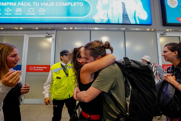 Passenger Diego Valenzuela is embraced by his mother after he arrived in Santiago, Chile, after experiencing Monday's nose dive on a 787 Dreamliner between New Zealand and Australia.