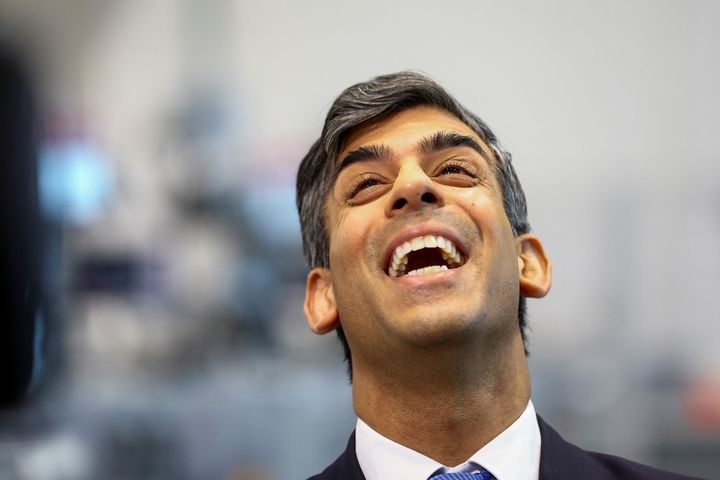 Rishi Sunak reacts during a visit to an apprentice training centre at the Manufacturing Technology Centre (MTC) on March 18, 2024 in Coventry.