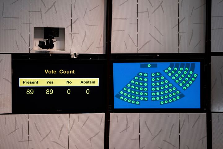 A screen displays the vote count after the third reading of the Basic Law Article 23 legislation at the Legislative Council in Hong Kong, Tuesday, March 19, 2024. Hong Kong’s lawmakers unanimously passed a new national security law that grants the government more power to quash dissent in the southern Chinese city. (AP Photo/Louise Delmotte)