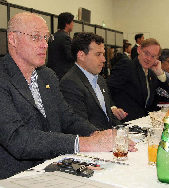 Then-Treasury Secretary Henry Paulson, left, and then-Under Secretary for International Affairs David McCormick attend a G8 financial ministers meeting in Japan in June 2008. 