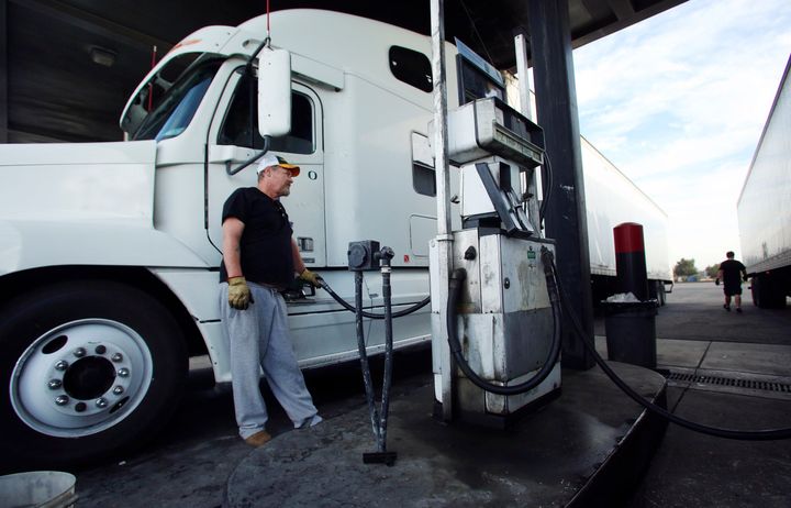 John Scoggins fuels up his FTS truck at the E-Z Trip truck stop before traveling down California State Route 99 as truckers deal with rising gas prices in Fresno, Calif., Friday, Oct. 5, 2012. Californians woke up to a shock Friday as overnight gasoline prices jumped by as much as 20 cents a gallon in some areas, ending a week of soaring costs that saw some stations close and others charge record prices. The average price of regular gas across the state was nearly $4.49 a gallon, the highest in the nation, according to AAA's Daily Fuel Gauge report. (AP Photo/Gary Kazanjian)