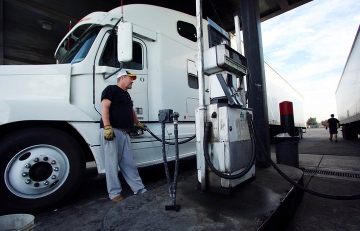 John Scoggins fuels up his FTS truck at the E-Z Trip truck stop before traveling down California State Route 99 as truckers deal with rising gas prices in Fresno, Calif., Friday, Oct. 5, 2012. Californians woke up to a shock Friday as overnight gasoline prices jumped by as much as 20 cents a gallon in some areas, ending a week of soaring costs that saw some stations close and others charge record prices. The average price of regular gas across the state was nearly $4.49 a gallon, the highest in the nation, according to AAA's Daily Fuel Gauge report. (AP Photo/Gary Kazanjian)