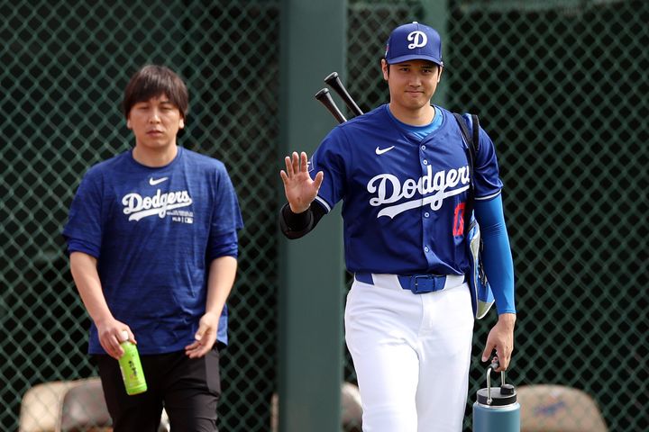 Shohei Ohtani appears beside Ippei Mizuhara before a game against the Chicago White Sox on February 27, 2024. Mizuhara is being accused of a "massive theft" against Ohtani.