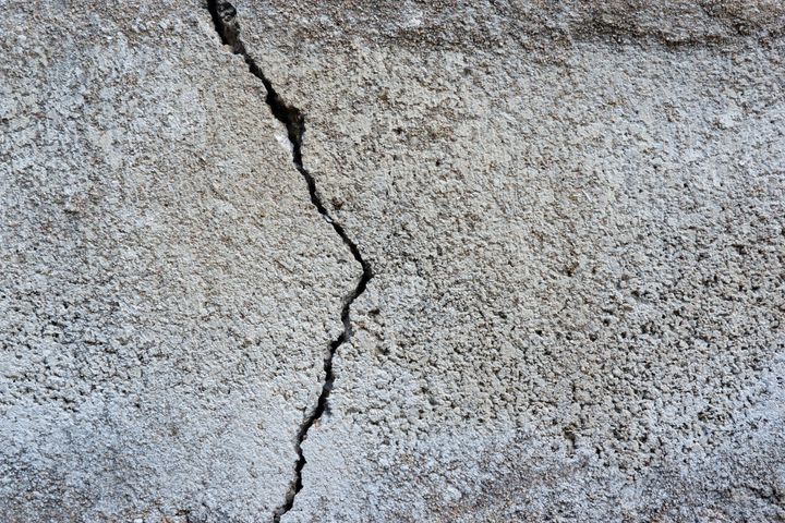 Cracked concrete wall background.