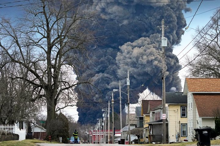 A black plume rises over East Palestine, Ohio, as a result of the controlled detonation of a portion of a derailed Norfolk Southern train on Feb. 6, 2023.