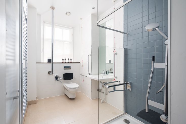 Rooms at the Voco Grand in Glasgow, Scotland, have a fully accessible bathroom with shower transfer seats.