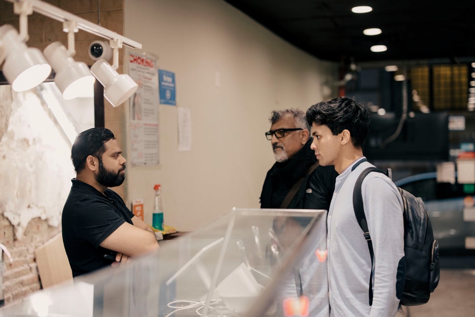 Amanullah and Khwaja speak to a halal restaurant manager on March 18, 2024 in Manhattan.