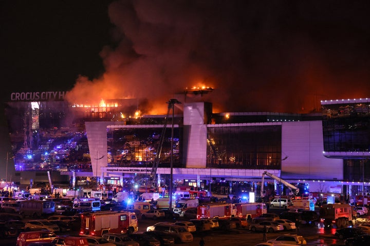 Emergency services vehicles are seen outside the burning Crocus City Hall concert hall following the shooting incident in Krasnogorsk, outside Moscow, on March 22, 2024. (Photo by STRINGER/AFP via Getty Images)